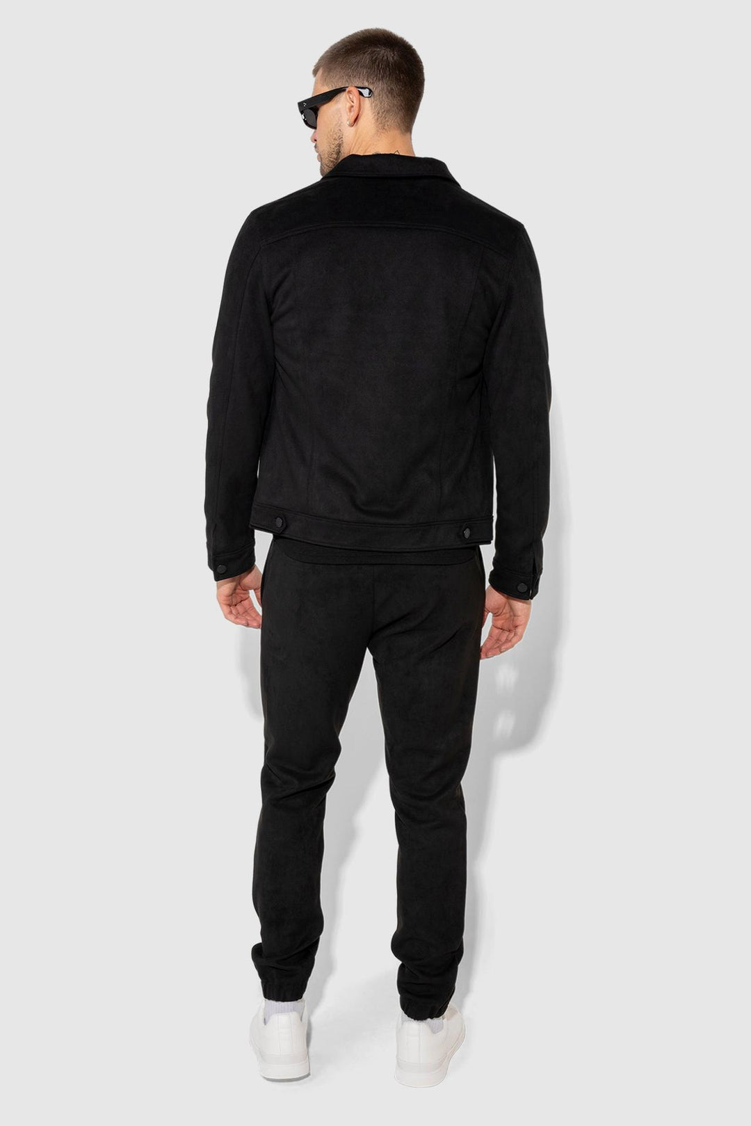 Detail view of MONFRÈRE Dean Butter Suede Noir men's black soft faux suede stretch fabric trucker jacket.
