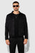Front profile of MONFRÈRE Dean Butter Suede Noir men's black soft faux suede stretch fabric trucker jacket.