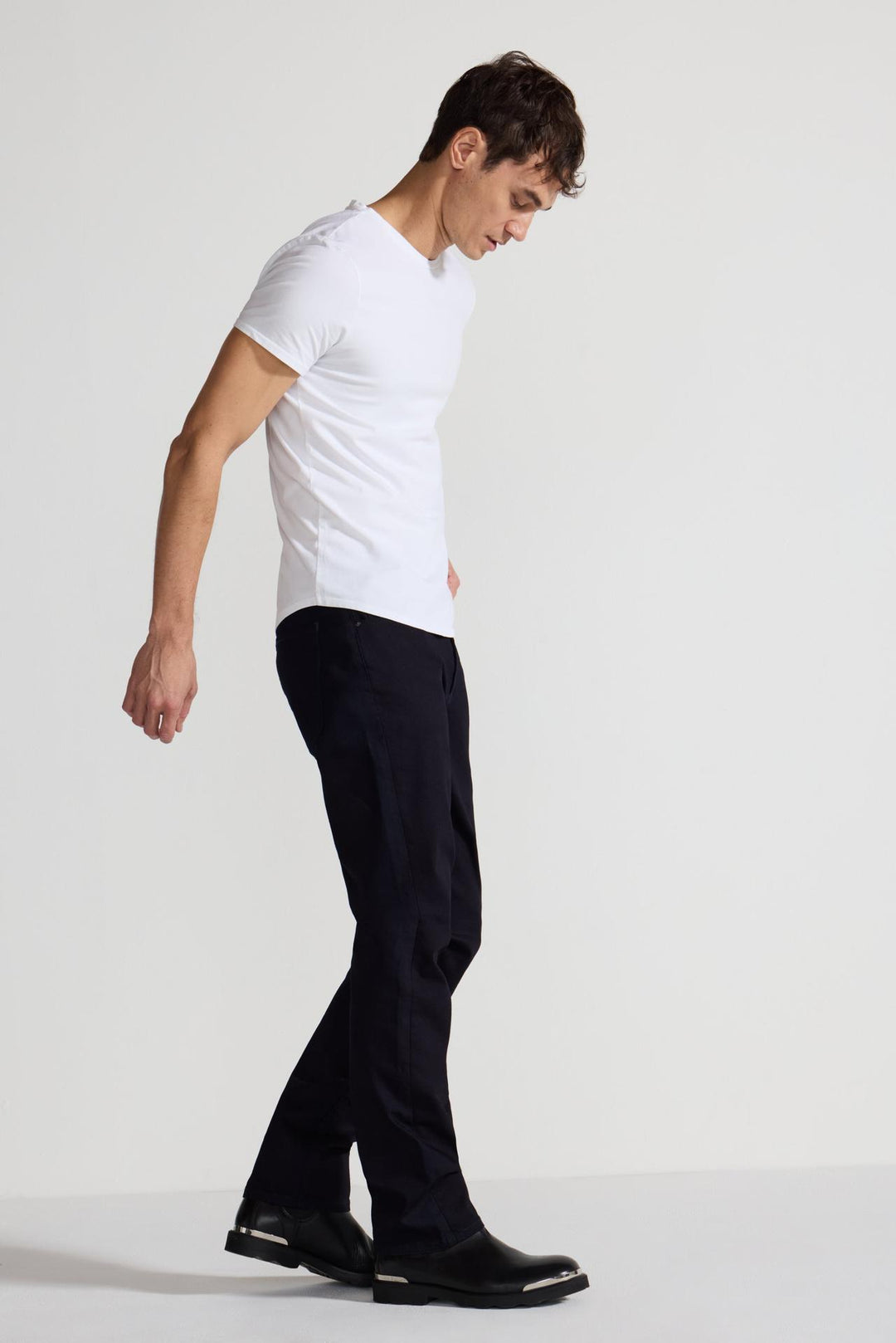 Side profile of MONFRÈRE Deniro Ink men's dark blue navy Japanese stretch denim five pocket slim straight jean.