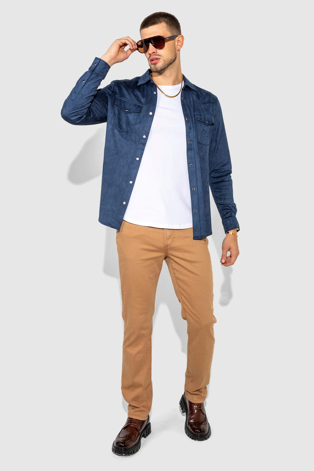 Model wearing MONFRÈRE Eastwood Butter Suede Navy men's blue soft faux suede stretch fabric western shirt.