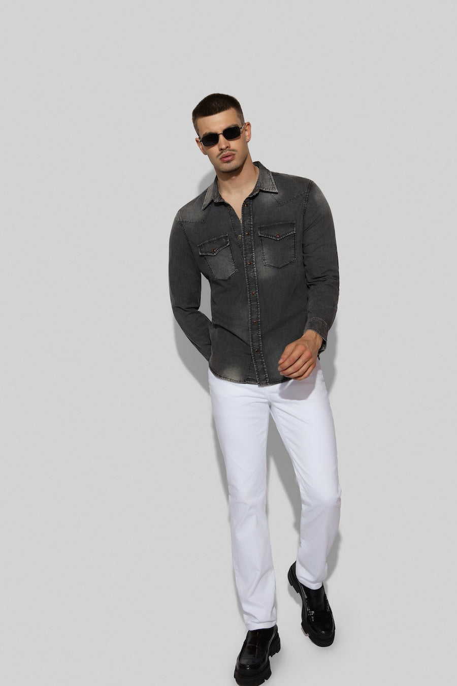 Model wearing MONFRÈRE Eastwood Smokescreen men's dark grey Japanese stretch denim western shirt.