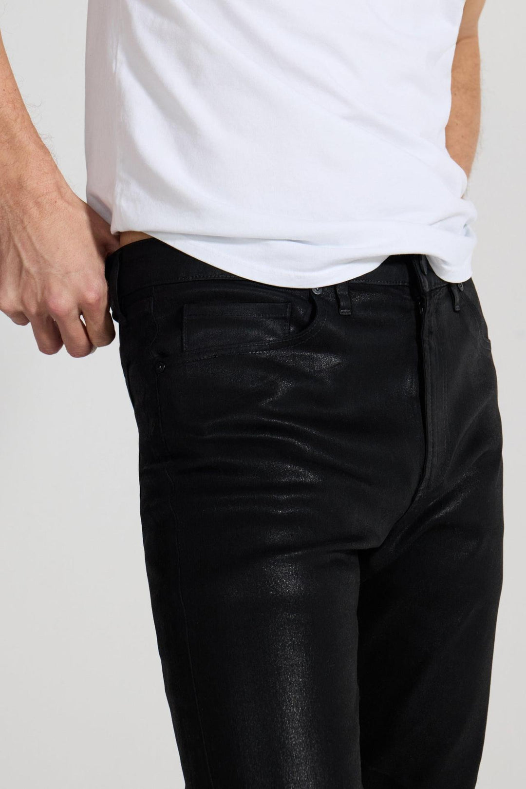 Close up of view MONFRÈRE Greyson Coated Noir men's black coated Japanese stretch denim five pocket skinny jean.