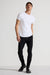Model wearing MONFRÈRE Greyson Coated Noir men's black coated Japanese stretch denim five pocket skinny jean.