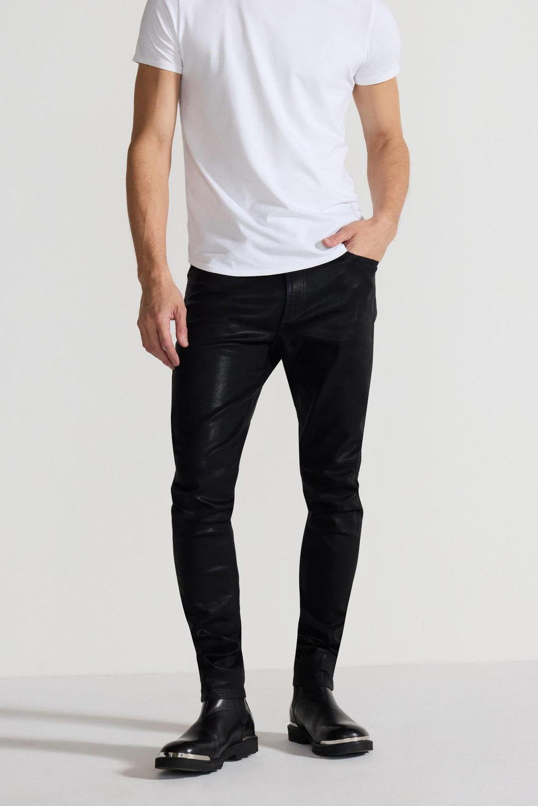 Front profile of MONFRÈRE Greyson Coated Noir men's black coated Japanese stretch denim five pocket skinny jean.