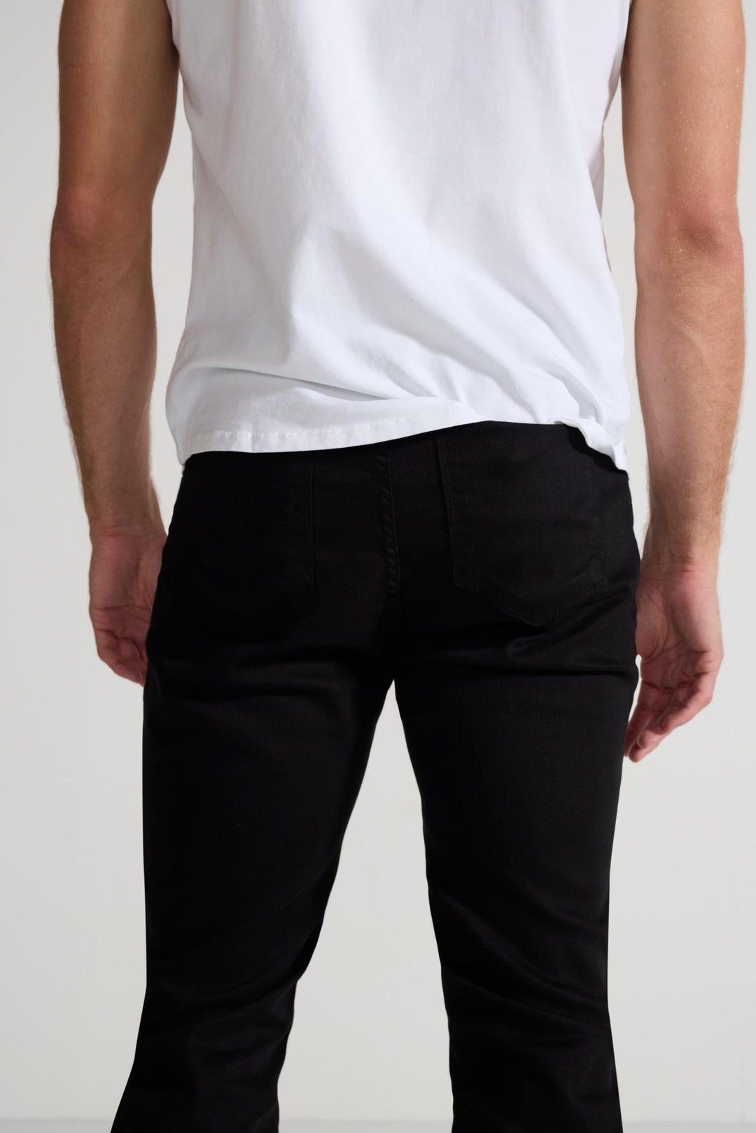Close up of view MONFRÈRE Greyson Noir men's black Japanese stretch denim five pocket skinny jean.