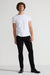 Model wearing MONFRÈRE Greyson Noir men's black Japanese stretch denim five pocket skinny jean.