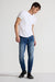 Model wearing MONFRÈRE Greyson Toulouse men's dark blue Japanese stretch denim five pocket skinny jean.