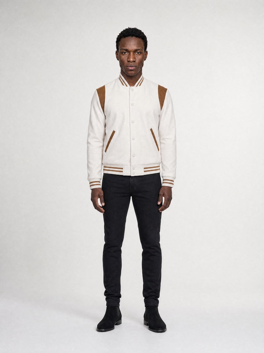 Model wearing MONFRÈRE Jeter Varsity Vintage Mocha men's off white ivory soft faux suede stretch fabric varsity jacket.