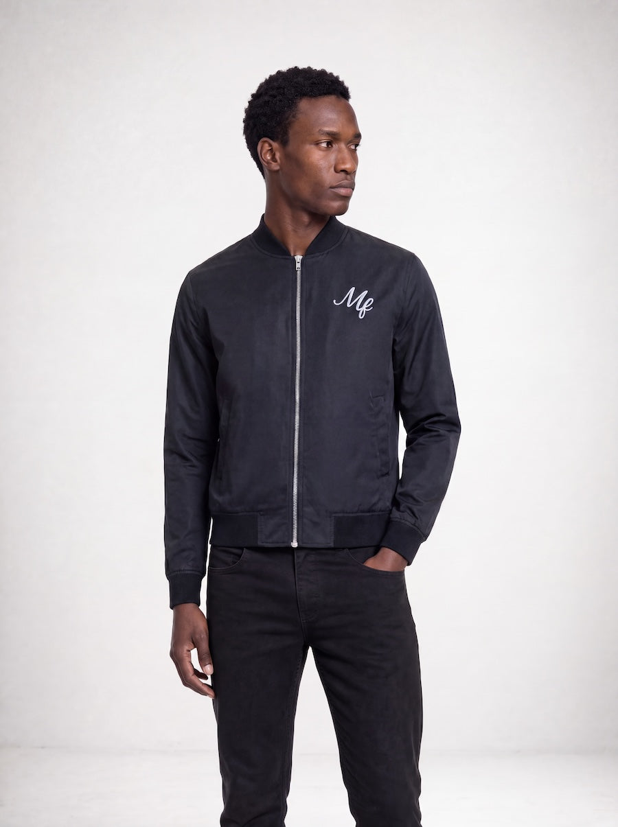 Detail view of MONFRÈRE Maverick Silk Noir Le Club men's black stretch viscose silk bomber jacket.