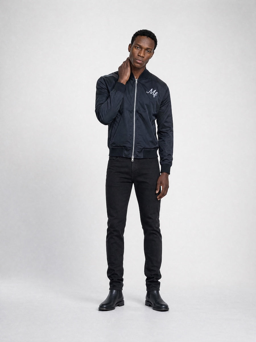Model wearing MONFRÈRE Maverick Silk Noir Le Club men's black stretch viscose silk bomber jacket.