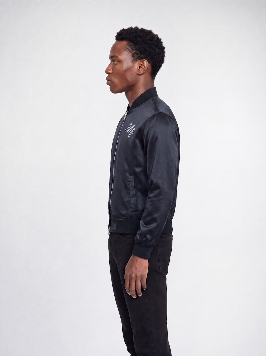 Side profile of MONFRÈRE Maverick Silk Noir Le Club men's black stretch viscose silk bomber jacket.