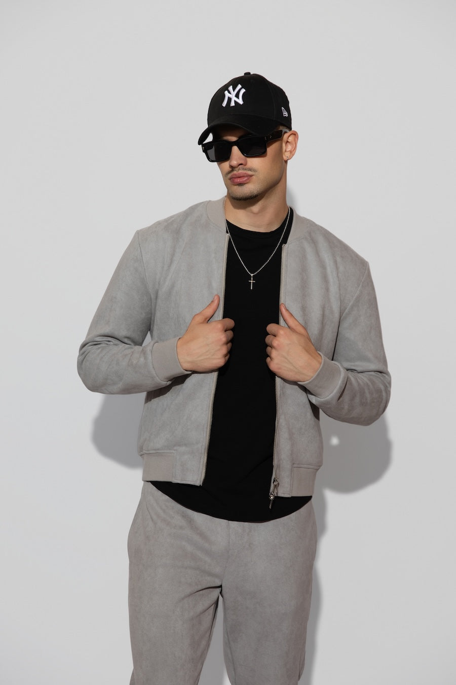 Front profile of MONFRÈRE Maverick Butter Suede Cool Grey men's light grey soft faux suede stretch fabric bomber jacket.