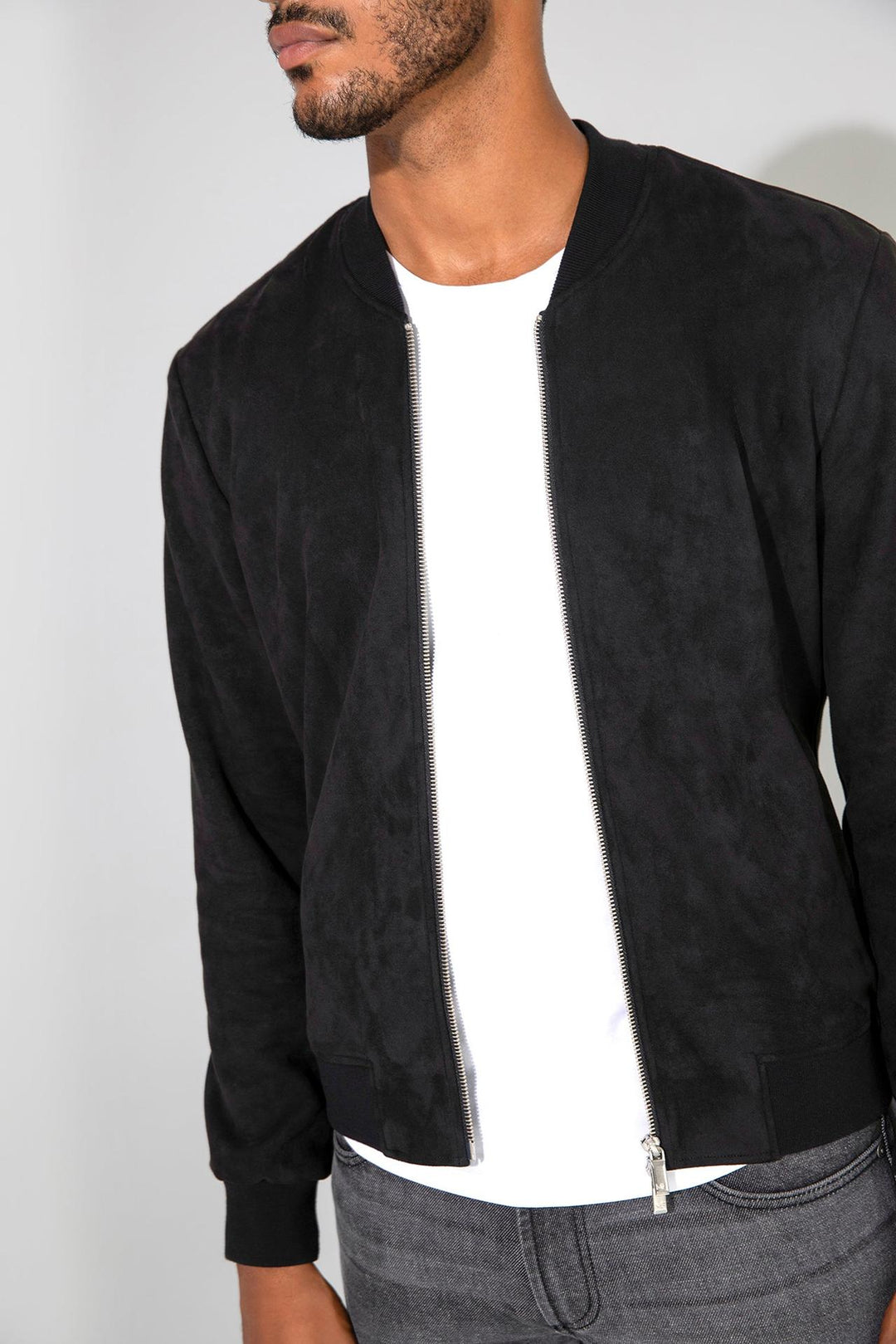 Close up of view MONFRÈRE Maverick Butter Suede Noir men's black soft faux suede stretch fabric bomber jacket.