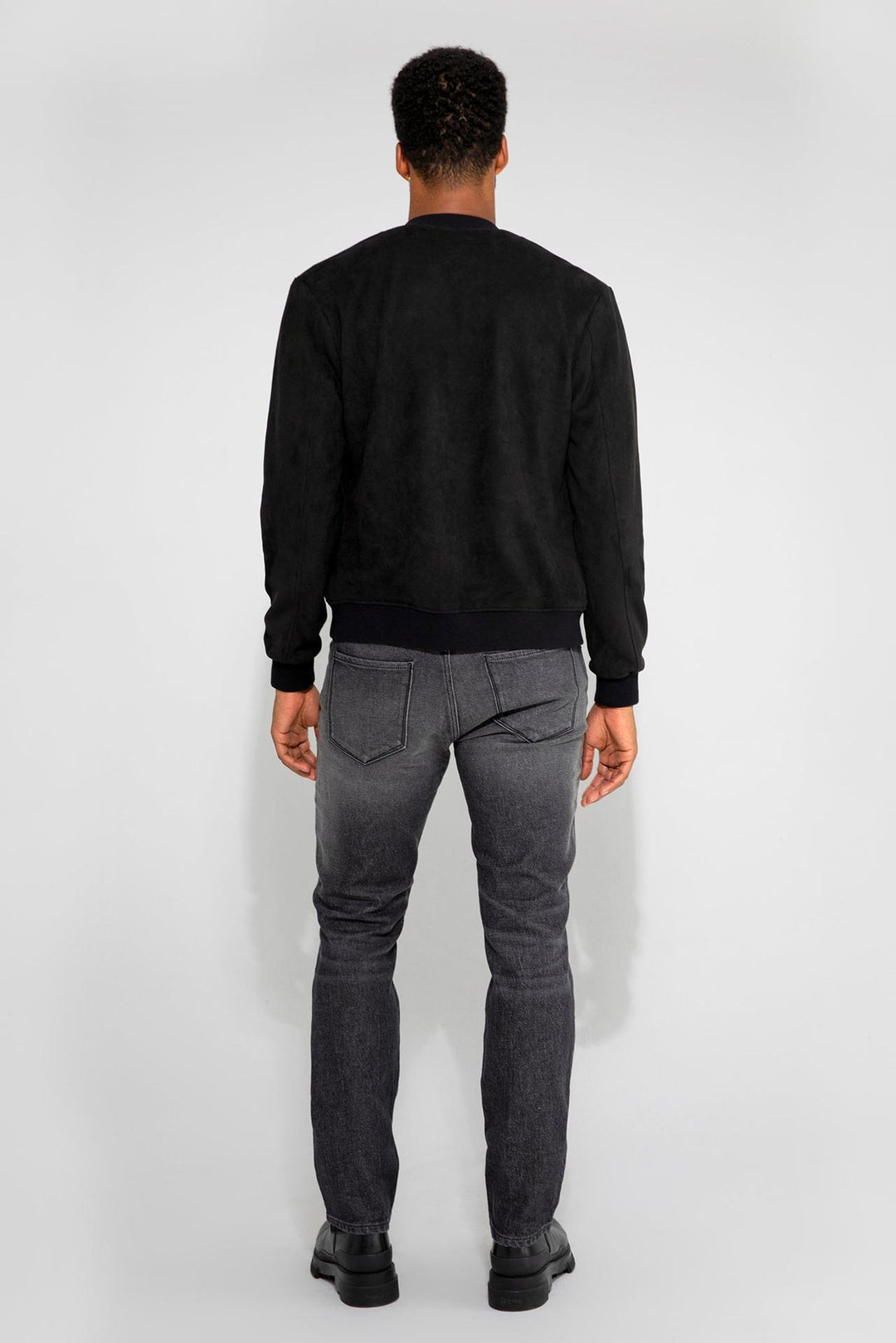 Detail view of MONFRÈRE Maverick Butter Suede Noir men's black soft faux suede stretch fabric bomber jacket.