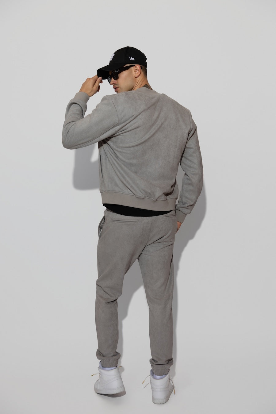 Detail view of MONFRÈRE Noah Butter Suede Cool Grey men's blue soft faux suede stretch fabric sweatpant jogger.