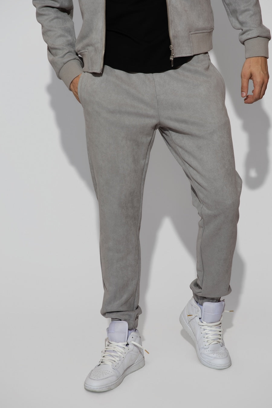 Front profile of MONFRÈRE Noah Butter Suede Cool Grey men's blue soft faux suede stretch fabric sweatpant jogger.
