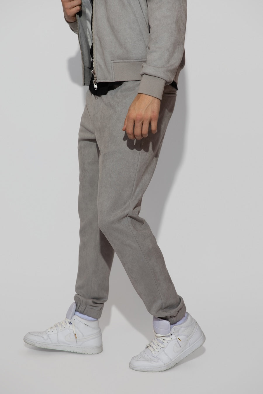 Side profile of MONFRÈRE Noah Butter Suede Cool Grey men's blue soft faux suede stretch fabric sweatpant jogger.
