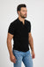 Side profile of MONFRÈRE Pierce Noir men's black stretch jersey knit polo shirt.