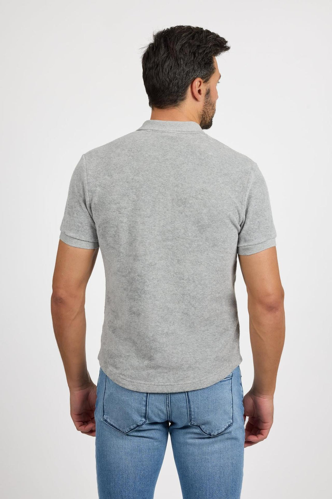 Back profile of MONFRÈRE Pierce Towel Terry Light Grey men's light grey stretch towel terry polo shirt.