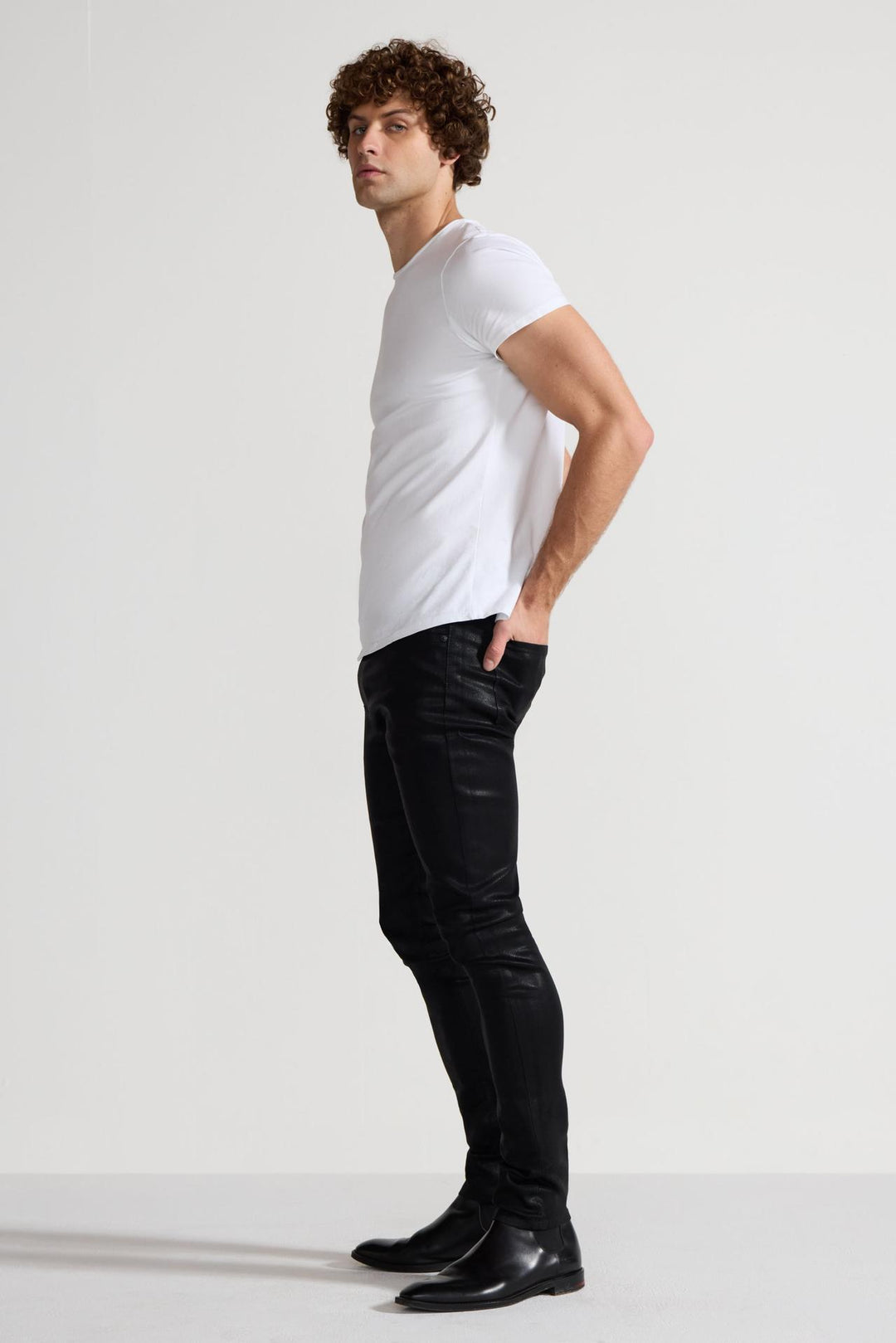 Side profile of MONFRÈRE Preston Coated Noir men's black coated stretch sateen tencel twill skinny cargo pants.
